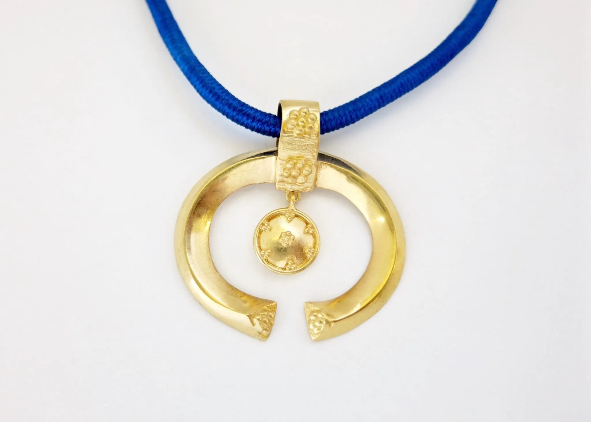 Beautiful and unique, Greek-inspired, open oval gold-plated pendant