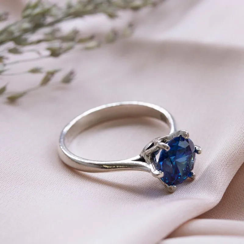 silver closed ring with dark blue cz 8mm facet