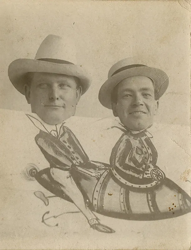 Untitled [two hat-wearing men perched behind painted panel of flying rocket]